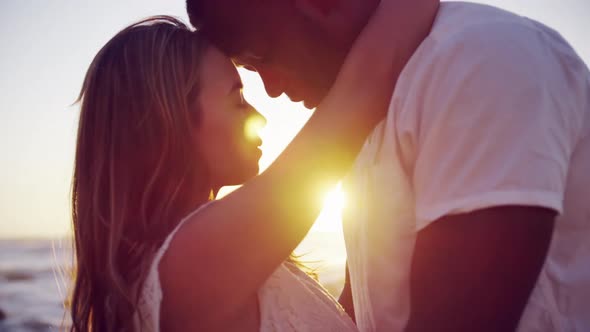 Couple embracing each other on the beach 4k