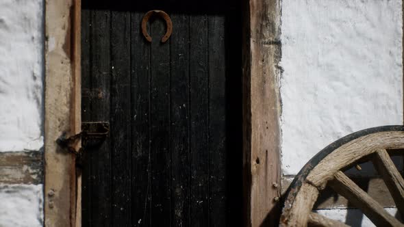Old Wood Wheel and Black Door at White House alt