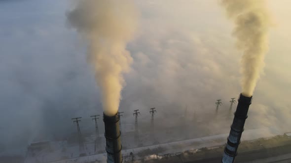 Aerial View of Coal Power Plant High Pipes with Black Smoke Moving Up Polluting Atmosphere at