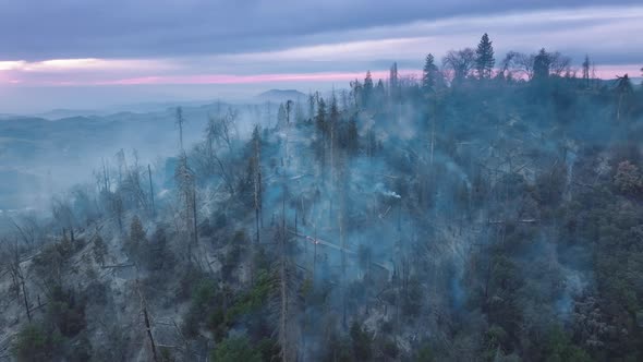 Drone Footage of Picturesque Sunrise Over Wildfire in Mountainous Landscape