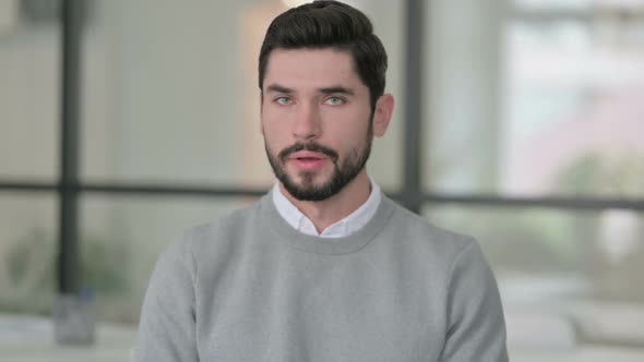 Portrait of Young Man Shaking Head As No Sign Denial