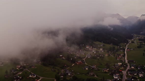 Panoramic View of a Picturesque Mountain Valley with a Village in a Lowland