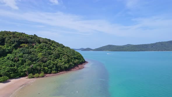 Aerial shot of open ocean Blue sky and horizon. Drone flying follow speed boats in the andaman sea