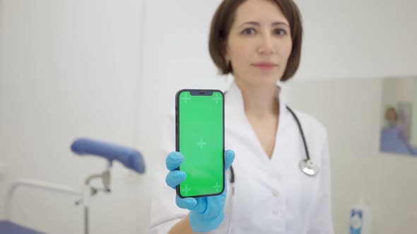 Gynecologist Shows an Smartphone with a Chromakey