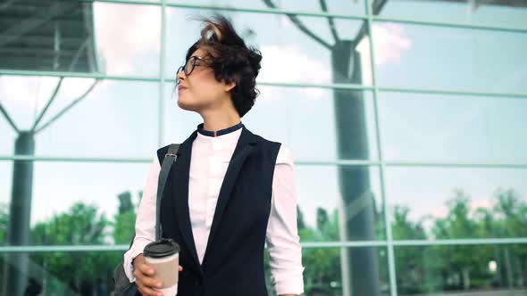 Young Beautiful Businesswoman Waiting for Somebody Looking at Watch Business Centre Background