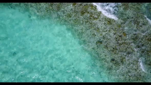Aerial drone seascape of beautiful coast beach holiday by blue ocean and white sand background of ad