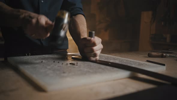 Man Hands Making Holes in Leather Belt with Professional Tools Creating Handmade Accessories at His