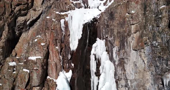 Freezing Waterfall in the Snowy Mountains