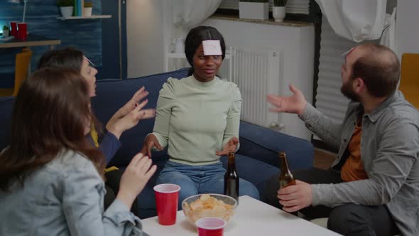 Group of Multiethnic Friends with Sticky Notes Putting on Forehead