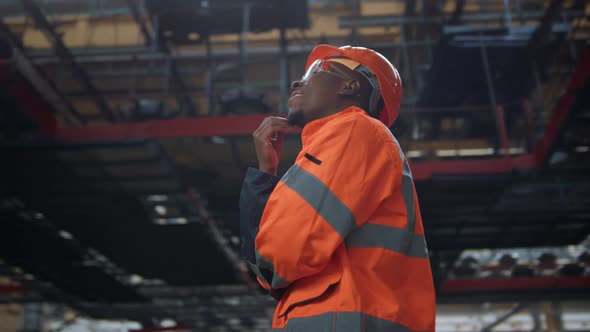 Black Hair Supervisor Thinking Project Work at Modern Production Facility