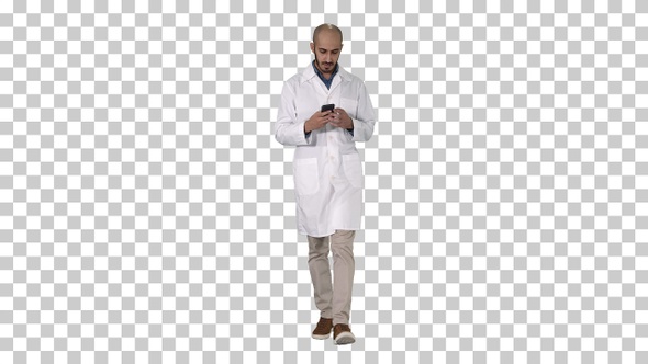 Male Arab Doctor Texting Message on The Phone While Walking