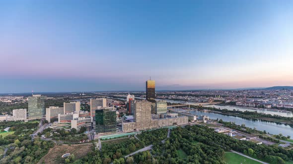 Aerial Panoramic View Over Vienna City with Skyscrapers Historic Buildings and a Riverside Promenade