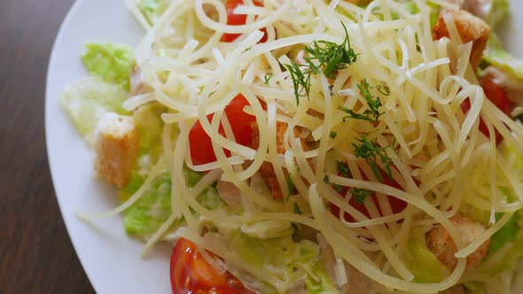 Caesar Salad with Chicken Meat Lettuce and Parmesan Cheese