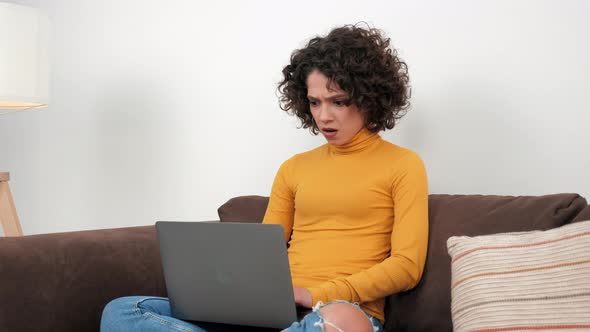 Shocked Businesswoman Works for Computer Looks at Laptop Screen Worried Problem