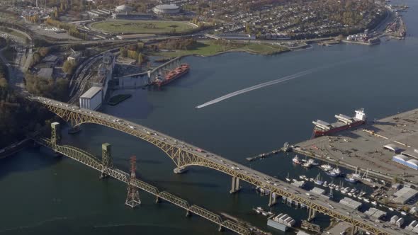 Vehicles Driving At Iron Workers Memorial Bridge Next To Second Narrows Rail Bridge Over Burrard Inl