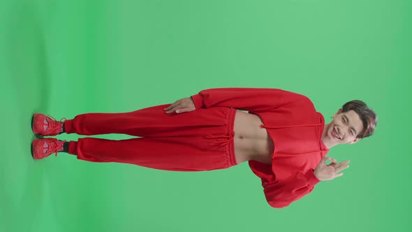 Full Body Of A Portrait Of A Happy Asian Transgender Male Showing Okay Gesture On Green Screen