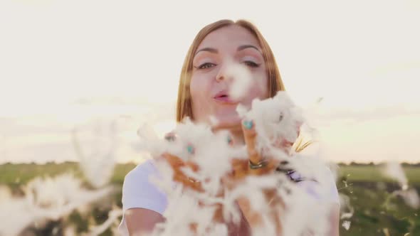 A Young Woman Is Playing with a Gentle Light Down