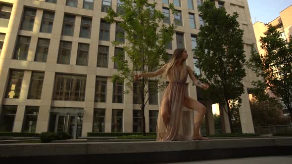 Beautiful Young Girl Dancing Performing Contemporary on the Street of a Modern City