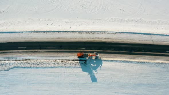 Aerial View Snow Removal Tractor Clears Road From Snow