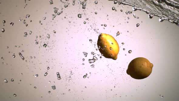 Water splash with fruit in ultra slow motion 