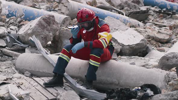 Black Paramedic Using Smartphone After Disaster