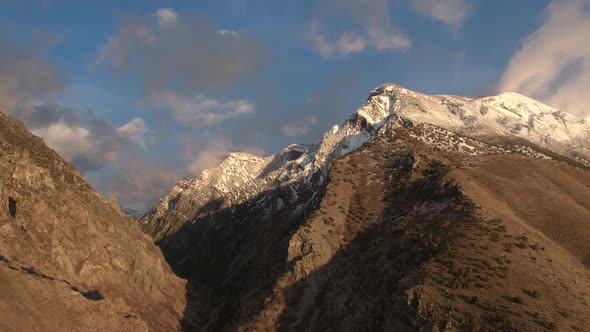 Aerial view of mountain tops at mouth of canyon