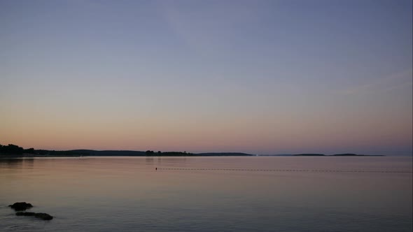 Sea View Before Sunrise. Calm Sea Surface in Delicate Shades