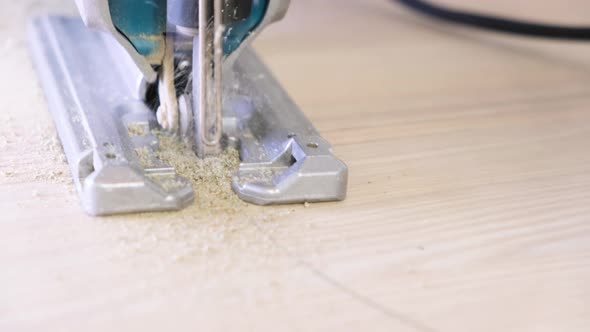 Working Fretsaw Closeup Carpenter Sawing Wood with the Electric Saw Fretsaw Saw with an Electric