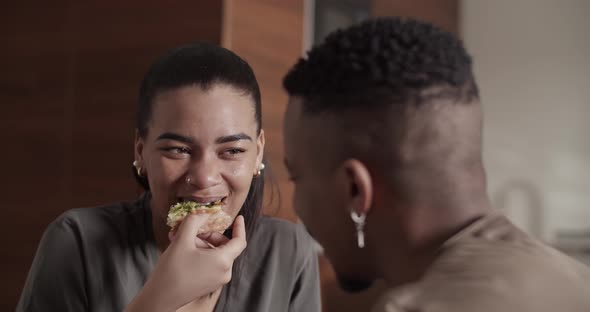 Happy Couple Eating Pizza and Talking