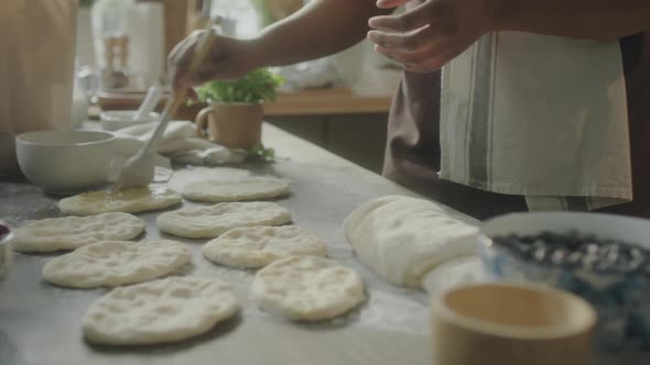 Food Blogger Applying Wash to Dough before Baking