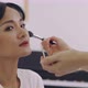 Asian Wedding Makeup Artist Making A Make Up For Bride. Artist Applying Cosmetic On Bride Face. - VideoHive Item for Sale