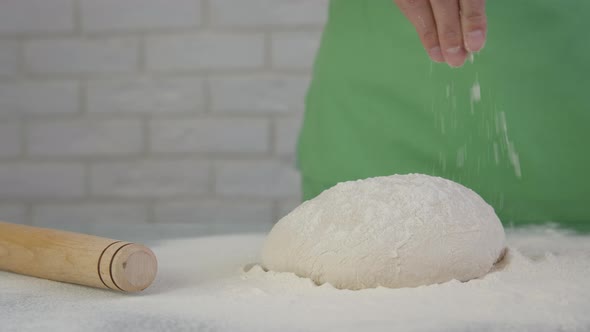 Sprinkle flour on the dough