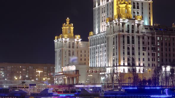 Hotel Ukraine Winter Night Timelapse Hyperlapse with Ship on Moscow River.