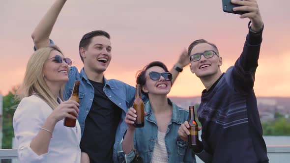 Happy People Making Photo With Beer Outdoors. Friends Party