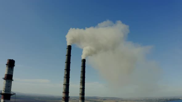 Aerial Drone View of Emission to Atmosphere From Industrial Pipes