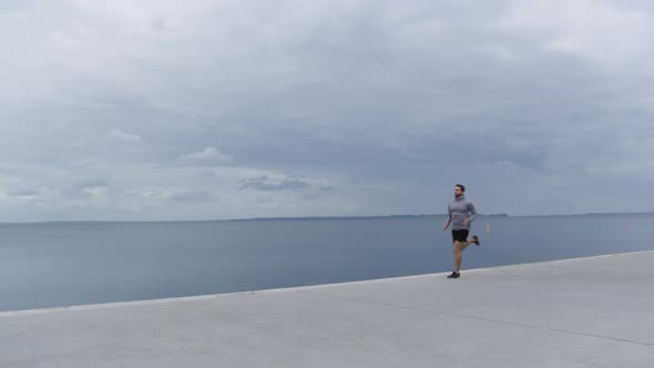 Athlete Running Along Promenade