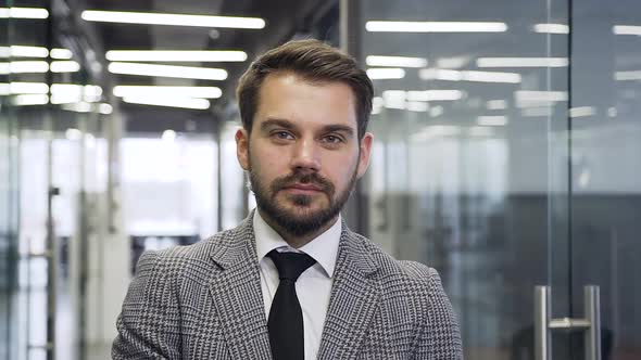 Bearded Businessman which Looking at Camera with Sincerely Smile