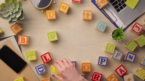 Woman Hand Arranging Wooden Cubes with Word WEB Top View