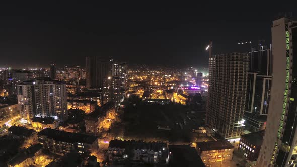 Building Construction From Day To Night. Timelapse. Tower Crane with Lighting in City Space