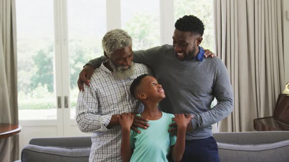 Mixed race man spending time with his father and his son