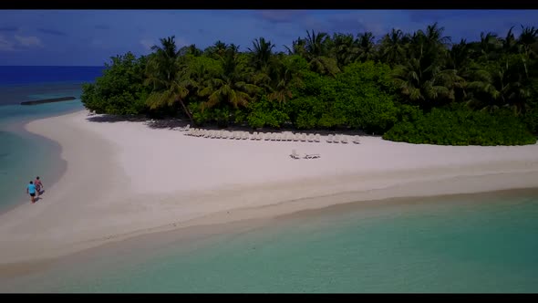 Aerial top view scenery of exotic island beach lifestyle by blue ocean and clean sandy background of