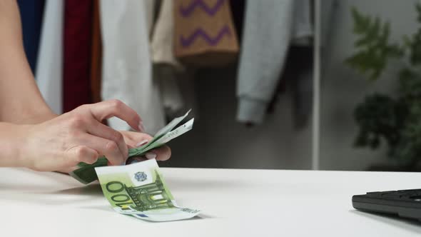 Counting Hundred Euro Banknotes at Shop
