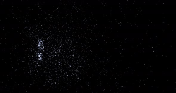 Splash water from the side blows out of the center around itself alt