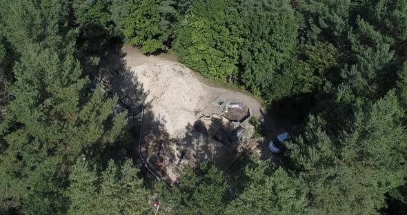 Aerial bird's eye view of polish boreal forest with sight seeing location with tourists in pomerania