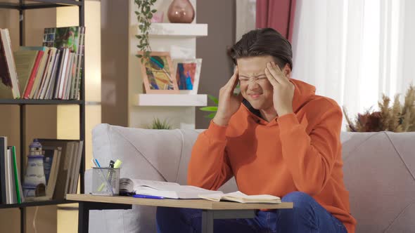 Young man with headache.