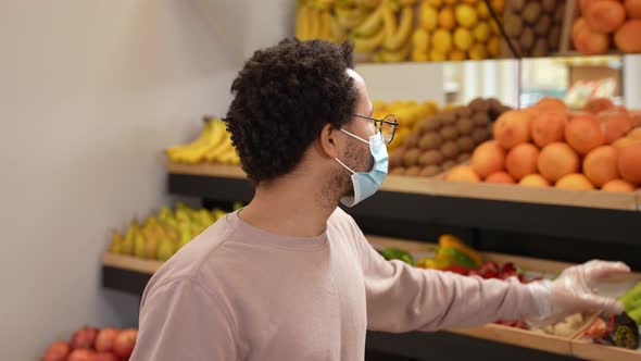 Young Man Wearing Mask During Shopping in Store