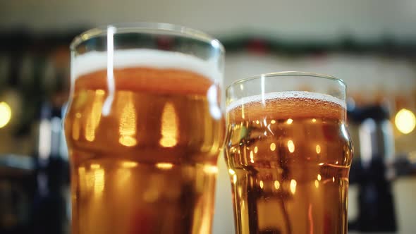 Foamy Beer in Glasses Closeup