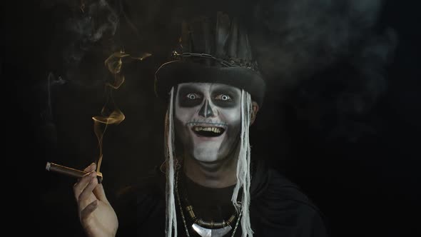 Creepy Man with Skeleton Makeup in Top-hat. Guy Smoking Cigar, Opening His Eyes, Making Faces