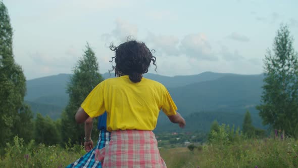 Joyful Traveler Couple Having Fun Enjoying Recreation and Freedom on Mountain Hill