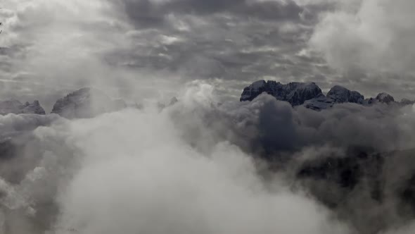Snow-capped Mountains in Clouds Landscape in Alps